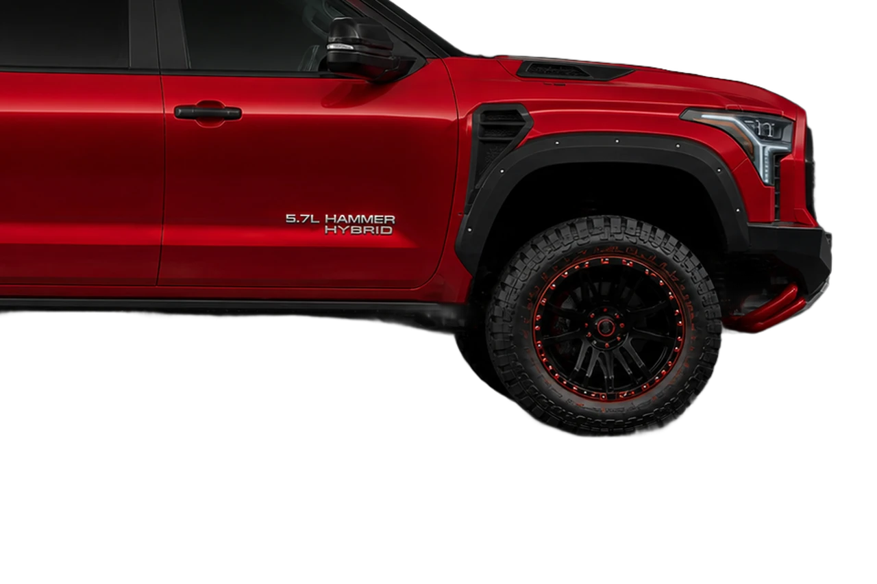 Close view of the Tundra HAMMER front wheel, 37-inch all-terrain tire and high-clearance arch.