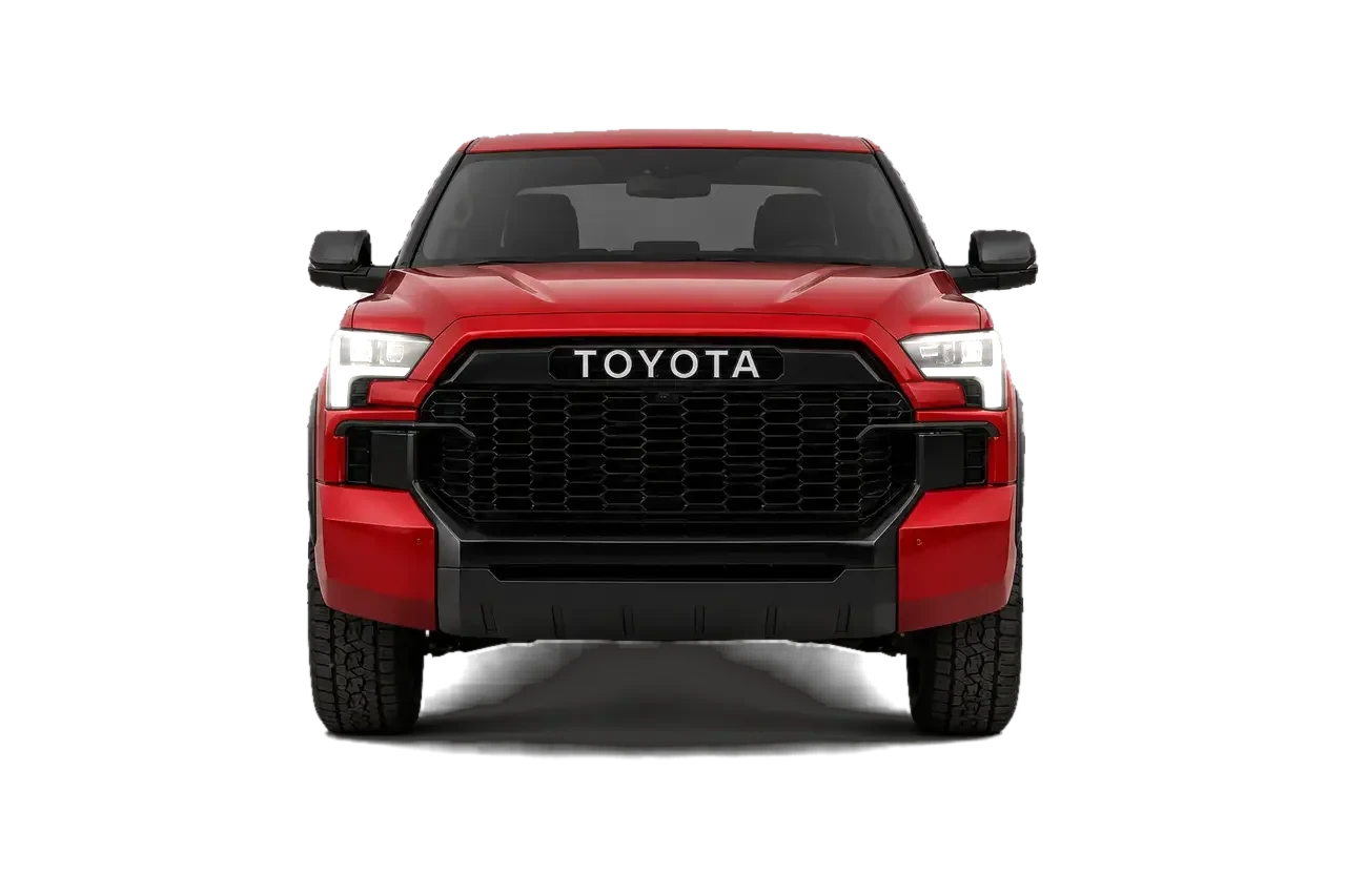 Head-on view of the Tundra HAMMER with its headlights lit, showing the blacked-out grille, wide front track and TOYOTA lettering.